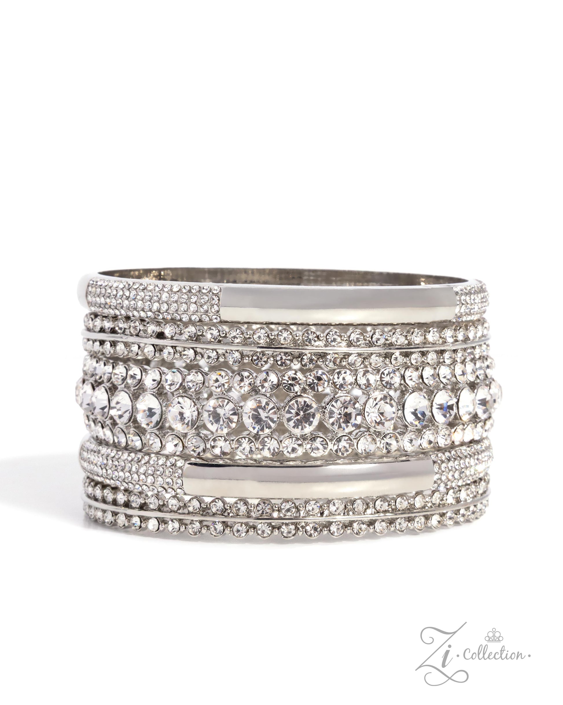 A wide silver-toned bangle bracelet embellished with multiple rows of clear rhinestones and round clear crystals, shown on a white background with a small 'Zi Collection' watermark in the lower right corner.