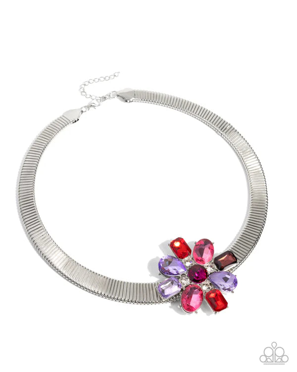 Silver necklace with colorful gemstones on a white background