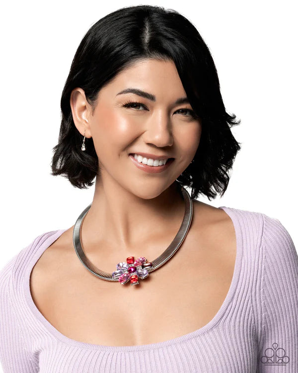 Woman wearing a floral necklace with a white background