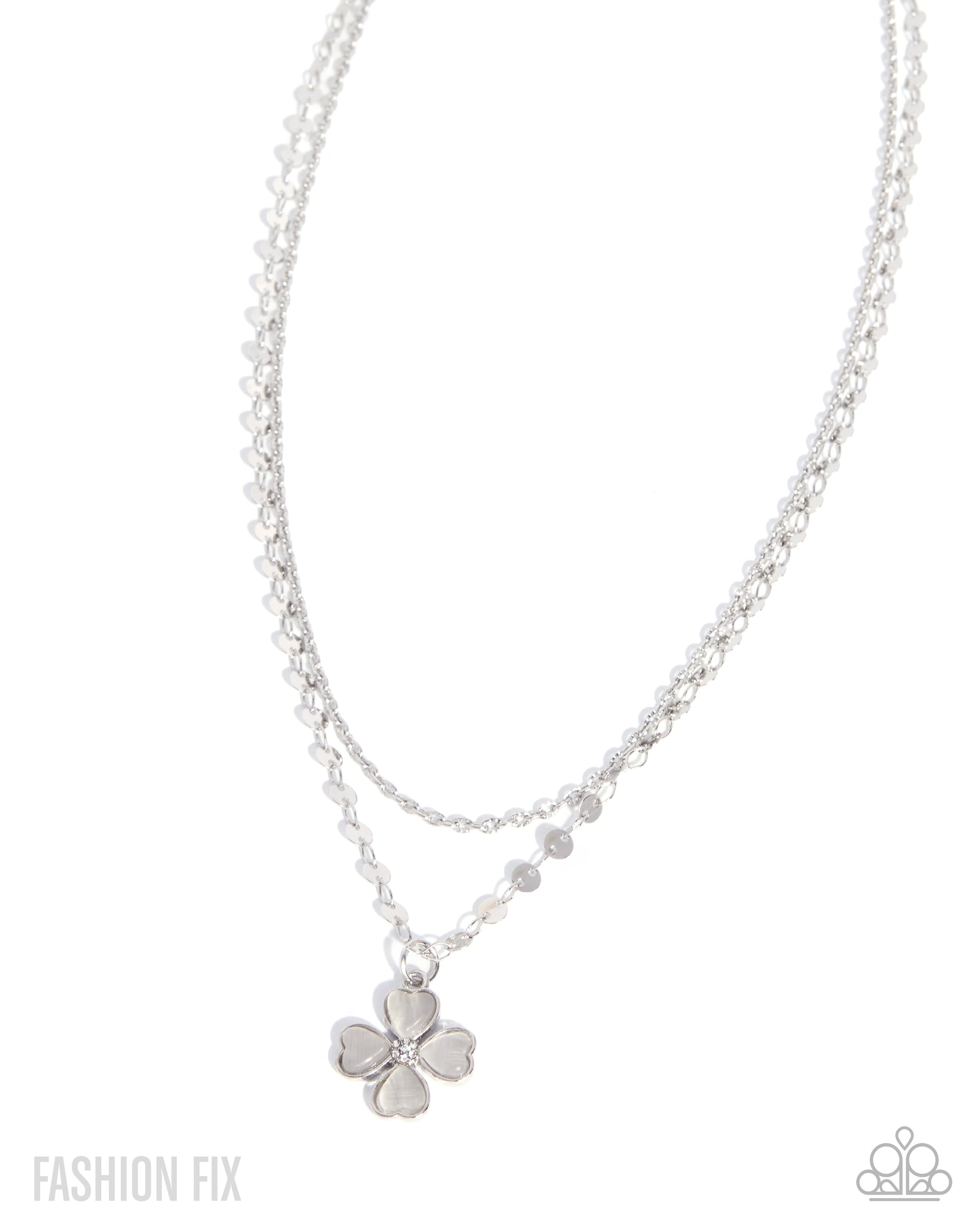 Silver necklace with a flower pendant on a white background