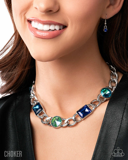 Necklace with blue and green gemstones worn by a model