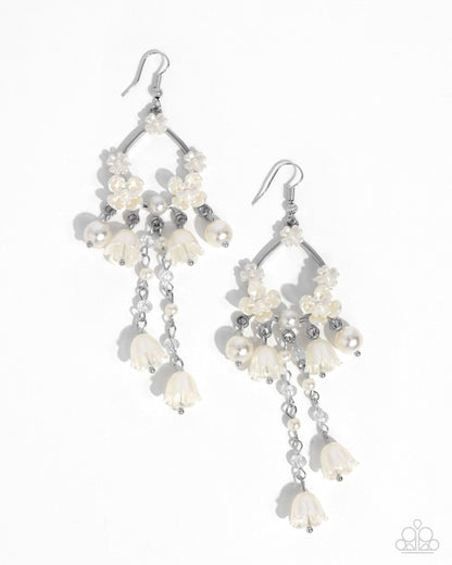 Harmonious Heir white pearl floral statement earrings worn on model