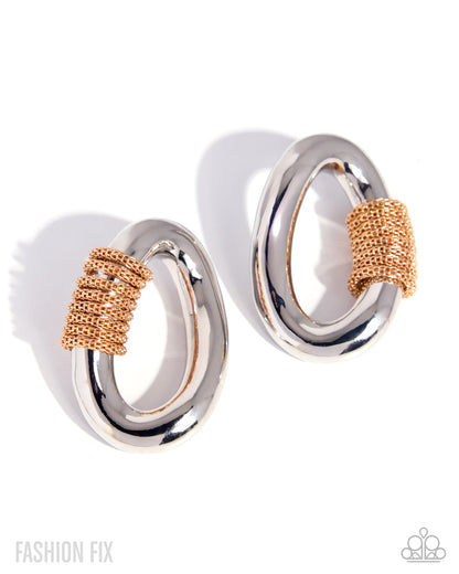 Pair of silver and rose gold hoop earrings on a white background