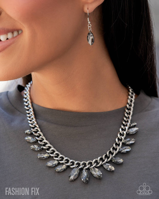 Necklace and earrings on a person wearing a gray shirt, with 'Fashion Fix' branding.