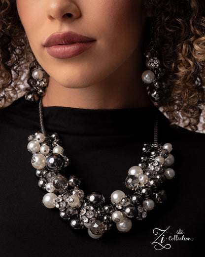 Close-up of a woman wearing a pearl and crystal necklace with matching earrings, branded 'Z Collection'.