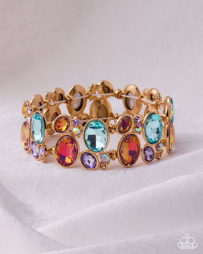 Gold bracelet with colorful gemstones on a white background