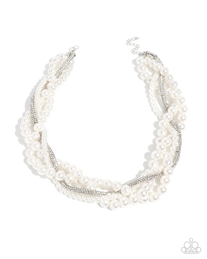 Multi-layered pearl necklace on a white background