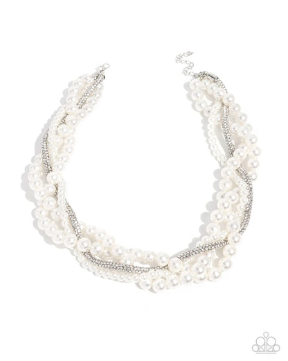 Multi-layered pearl necklace on a white background