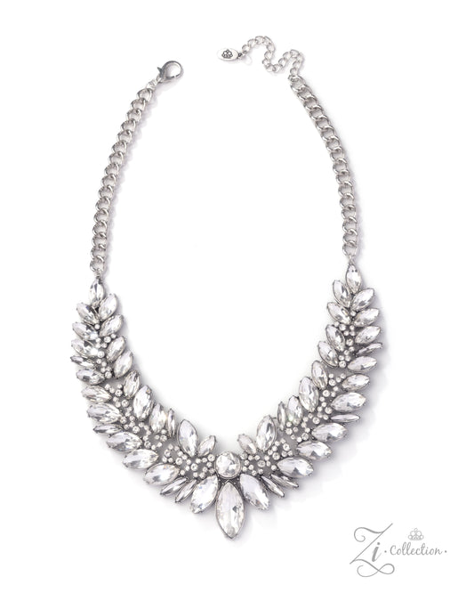 Silver necklace with leaf-like design on a white background