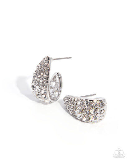 A pair of silver crescent-shaped stud earrings covered in clear rhinestones, displayed on a clean white background.