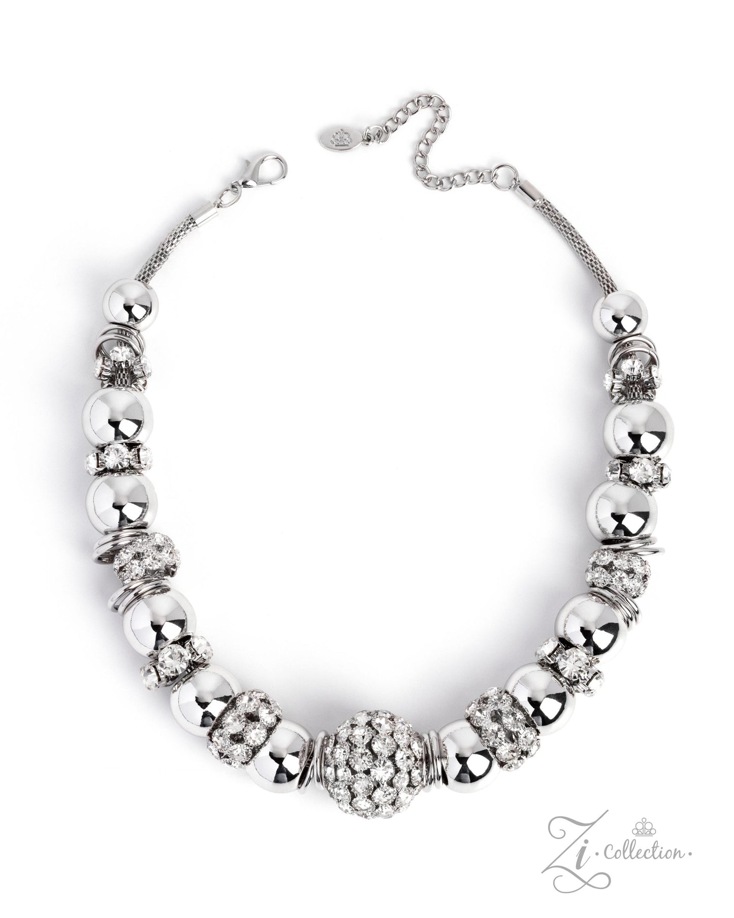 A silver-toned statement necklace featuring a central cluster of clear rhinestones surrounded by alternating polished silver beads and textured spacer beads, displayed on a clean white background.