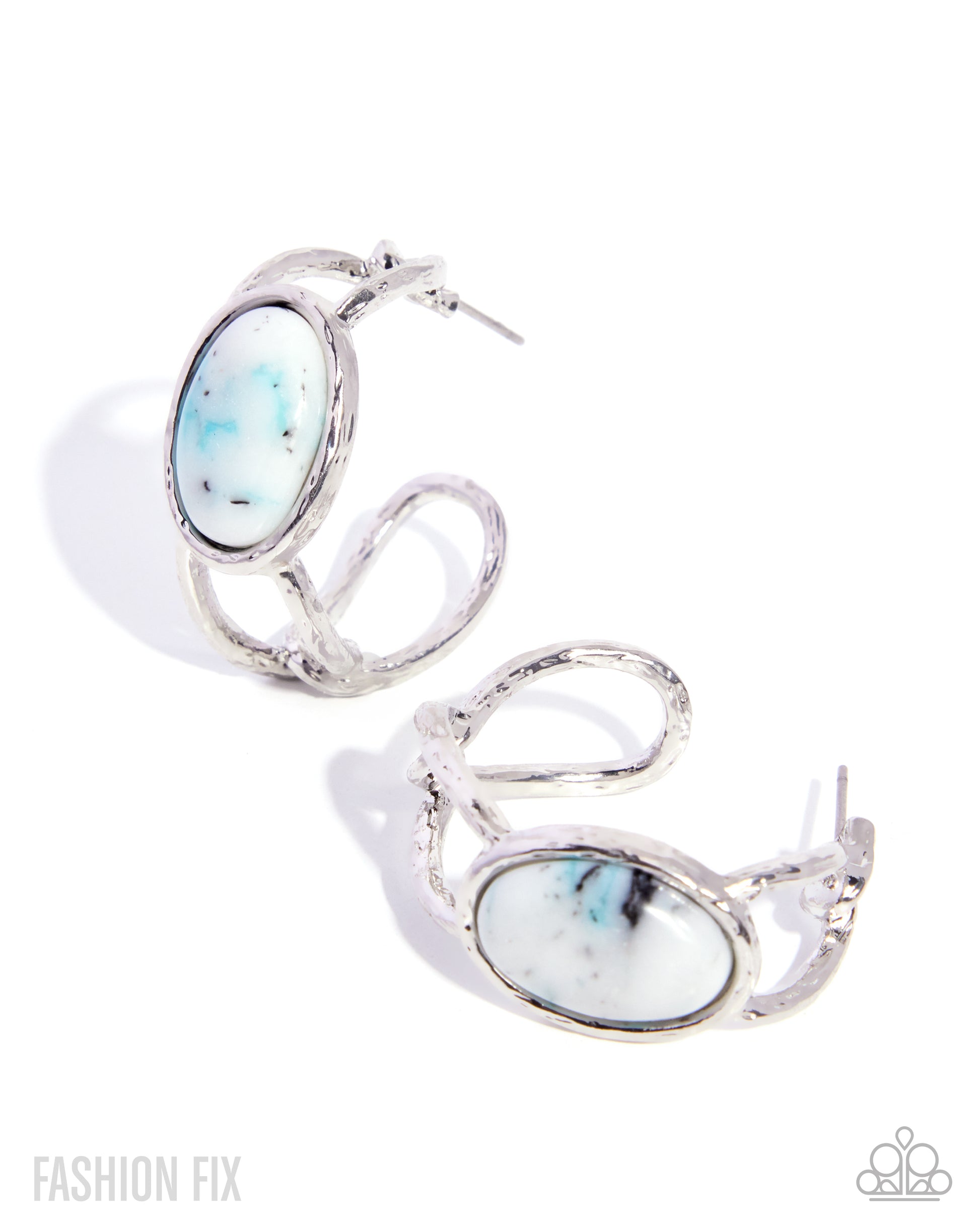 Pair of silver hoop earrings with blue gemstones on a white background