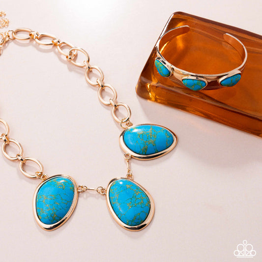 Jewelry set with turquoise stones and gold accents on a white background