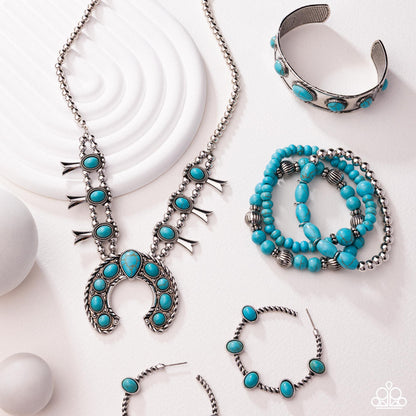 Turquoise and silver jewelry set including necklace, bracelets, and earrings on a white background.
