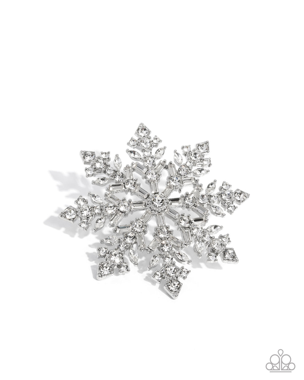 Silver snowflake-shaped brooch on a white background