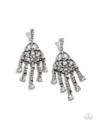 Pair of silver chandelier earrings with clear stones on a white background