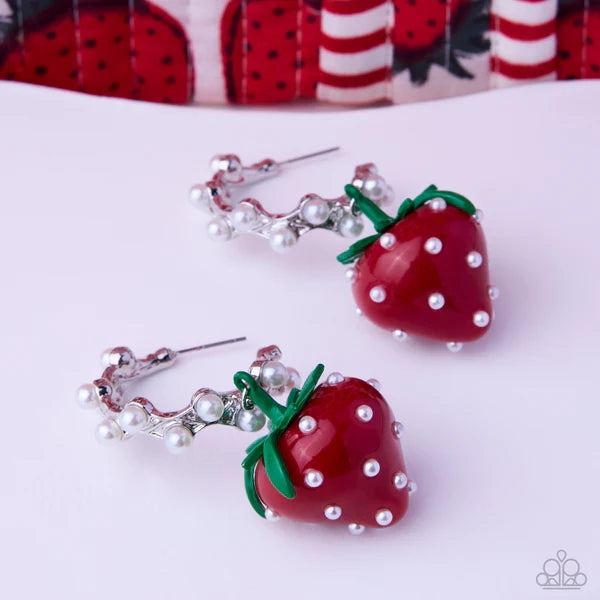 Strawberry-shaped earrings with pearl details on a white background