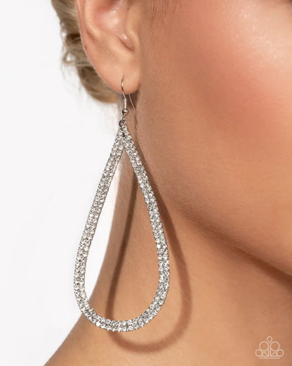 Silver teardrop earring on a model with a plain background