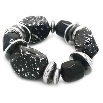 Black and white speckled bracelet on a white background
