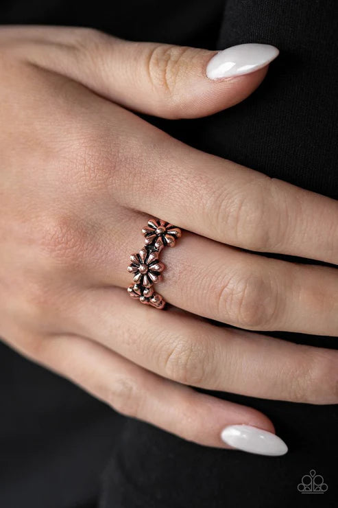 Paparazzi Daisy Dapper copper ring with a row of dainty daisy flowers