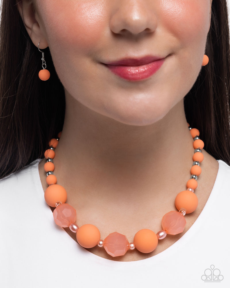 Suddenly Slanted orange pearl and faceted bead necklace detail