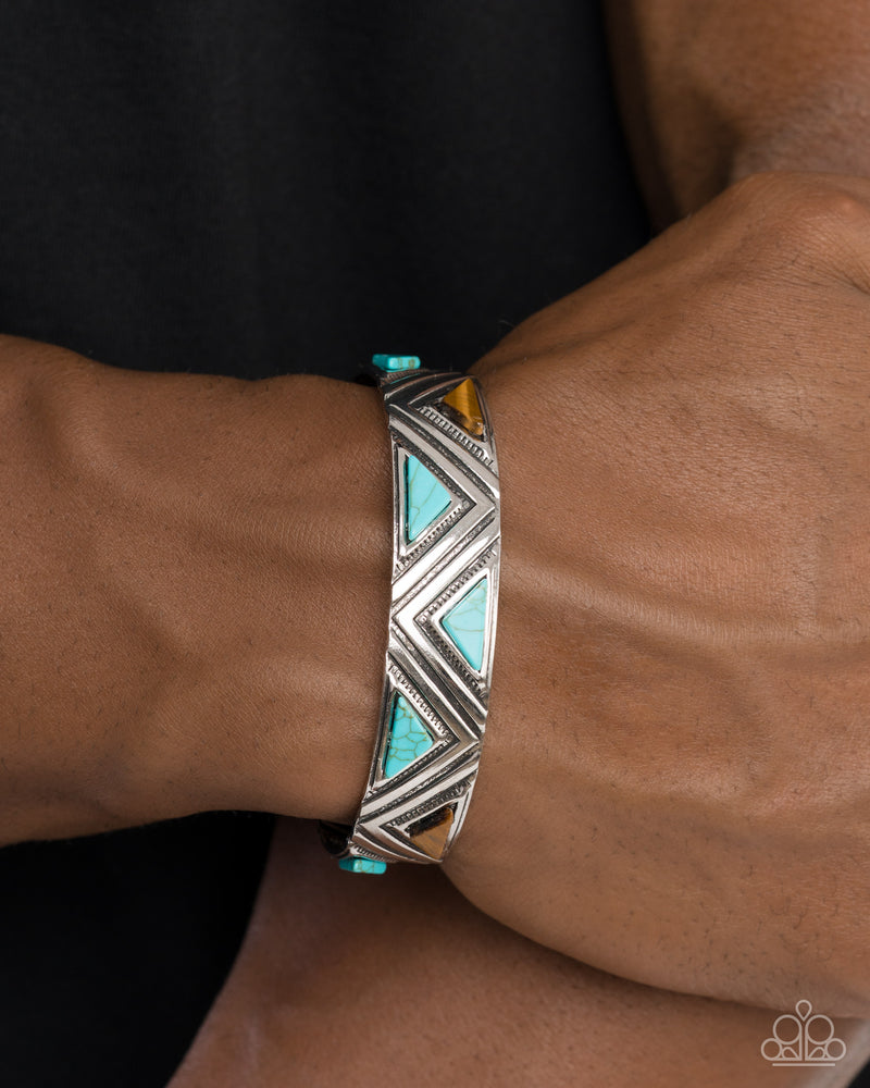 Tantalizing Triangles Blue silver cuff bracelet showing embossed chevron detail and natural stones