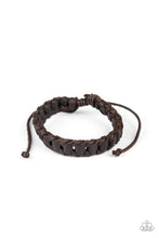 Grit and Grease - Brown Item #P9UR-BNXX-460XX Shiny brown cording threads through the center of a brown leather band, creating a rustic display. Features an adjustable sliding knot closure.  Sold as one individual.  New Kit