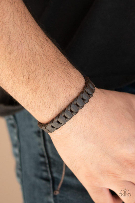 Grit and Grease - Brown Item #P9UR-BNXX-460XX Shiny brown cording threads through the center of a brown leather band, creating a rustic display. Features an adjustable sliding knot closure.  Sold as one individual.  New Kit