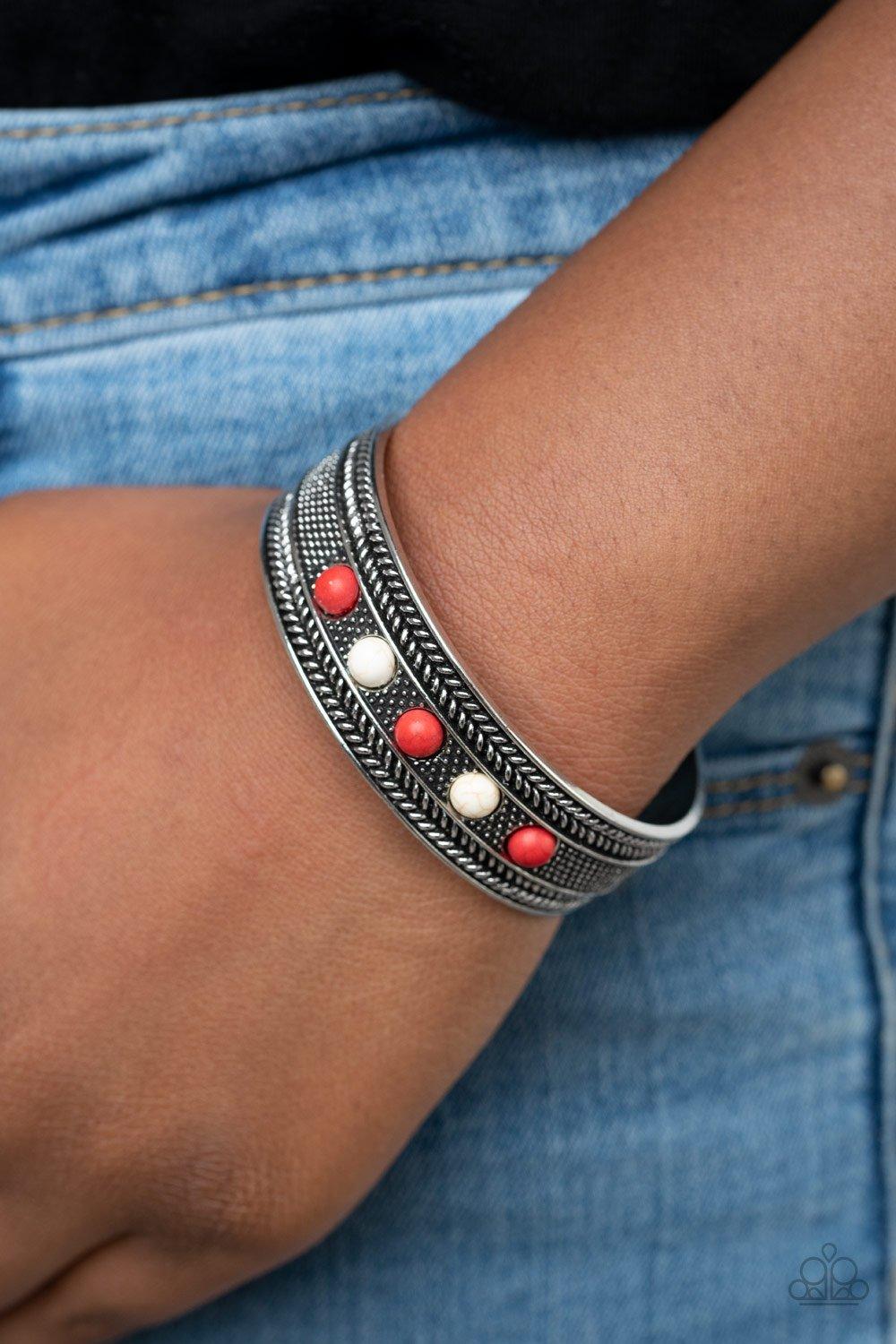 Quarry Quake - Red Item #P9SE-RDXX-200XX Dainty red and white stone beads are encrusted along the front of an ornate silver cuff studded and embossed in antiqued rope-like patterns.  Sold as one individual bracelet.  New Kit